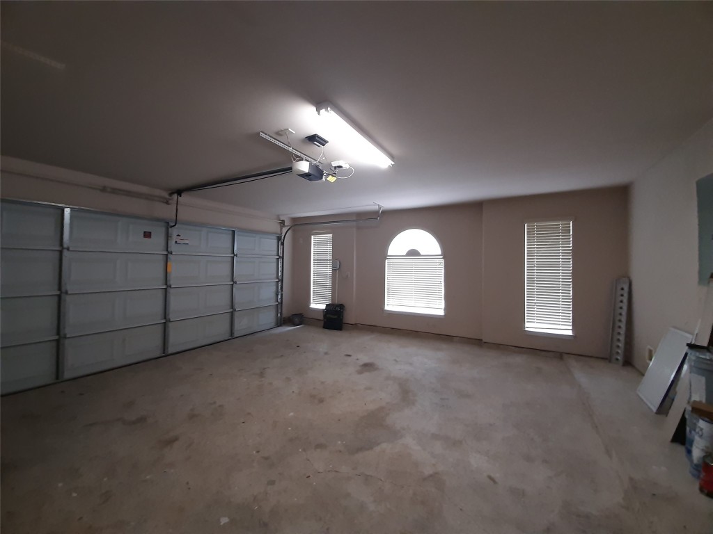 4214 Blue Sage Terrace Spring, TX 77388 - Photo 8 of 50 an empty room with chandelier fan and windows