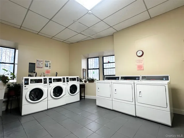 a sign board with a building in the background