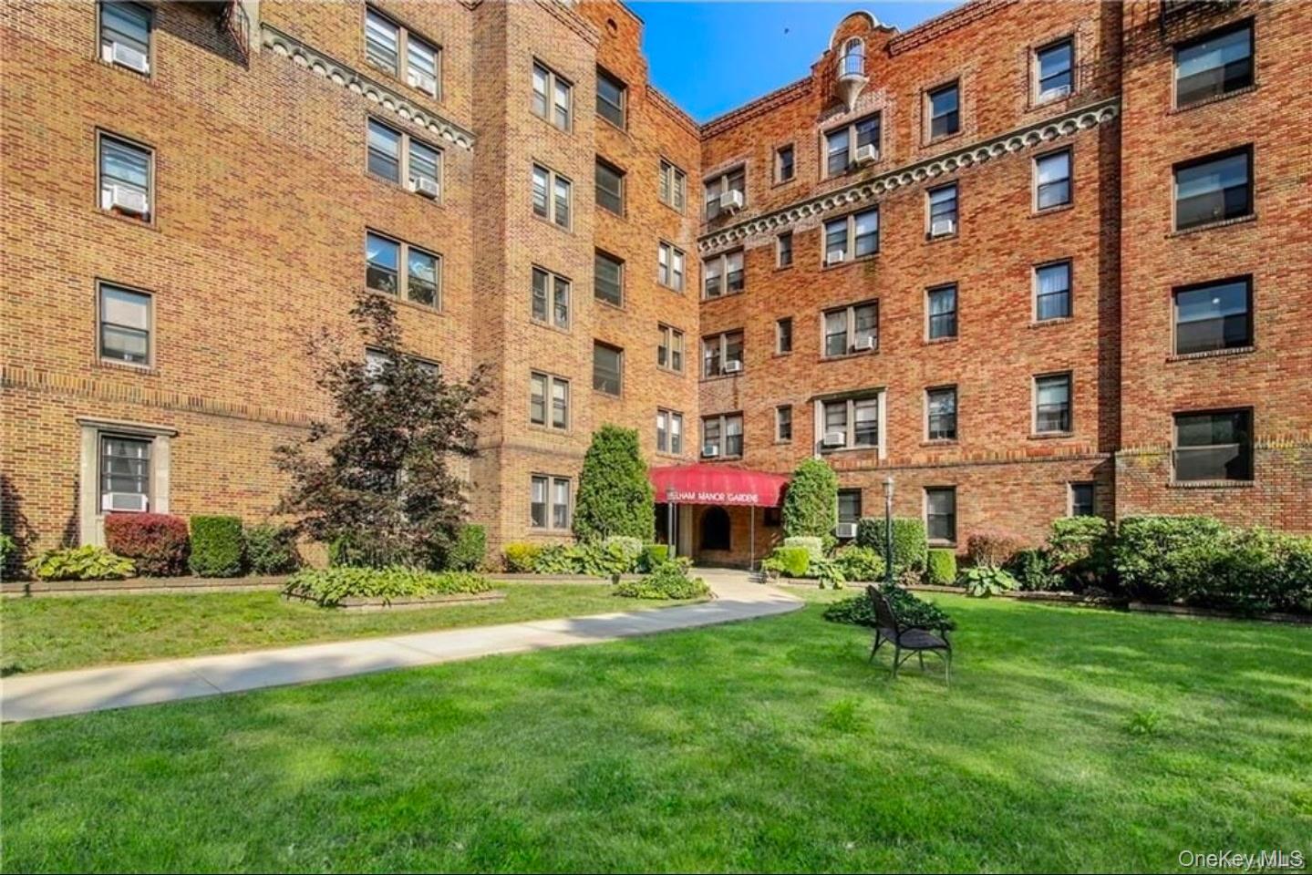 4810 Boston Post Road, Unit 4E Pelham, NY 10803 - Photo 19 of 26 a sign board with a building in the background