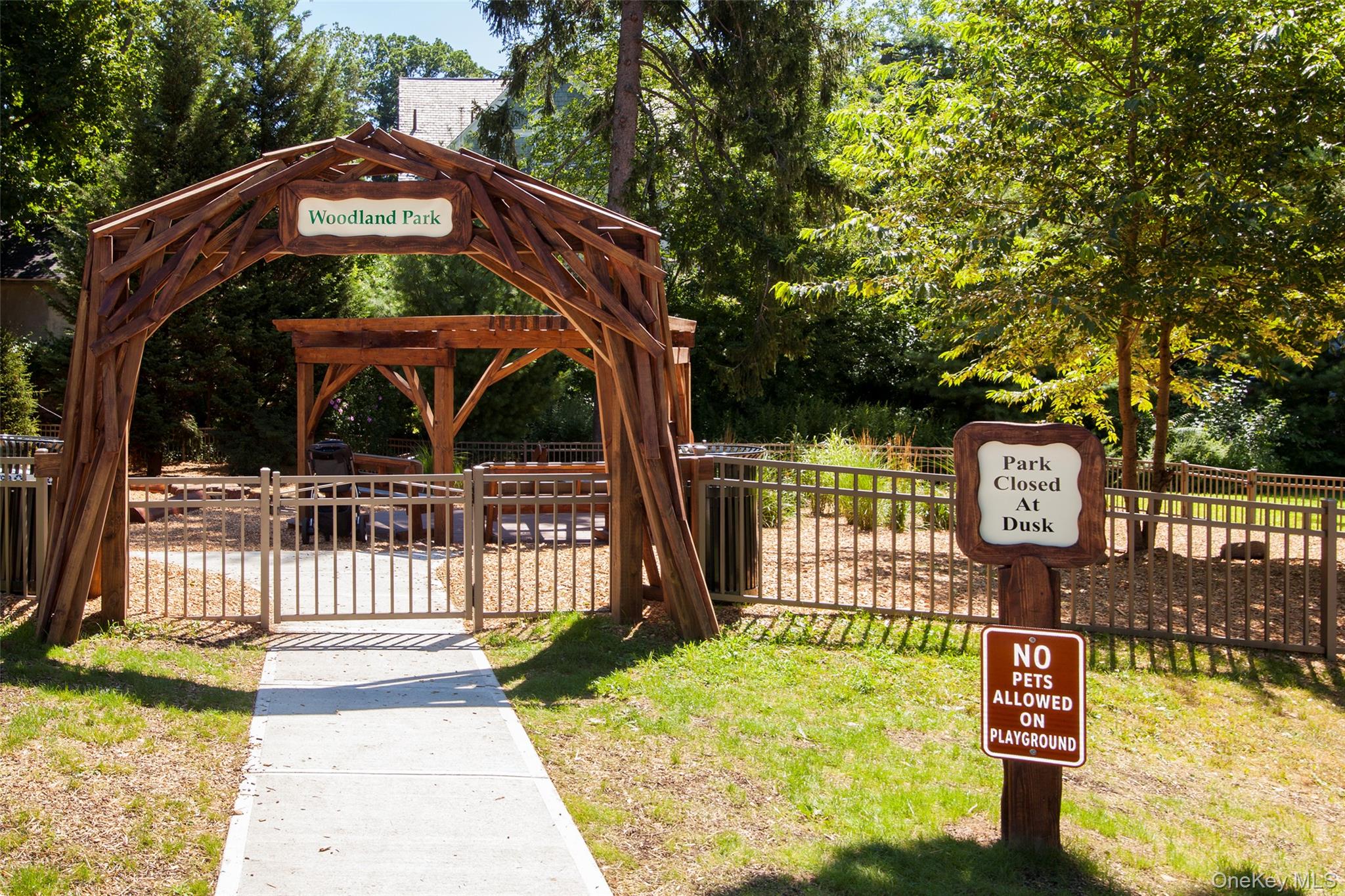 4810 Boston Post Road, Unit 4E Pelham, NY 10803 - Photo 25 of 26 a front view of a house with garden