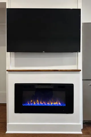 a kitchen with a refrigerator and a stove