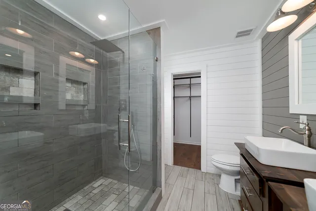a bathroom with a sink toilet and vanity