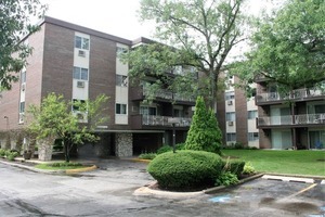 1331 South Finley Road, Unit 417 Lombard, IL 60148 - Photo 1 of 1 a front view of a building with garden