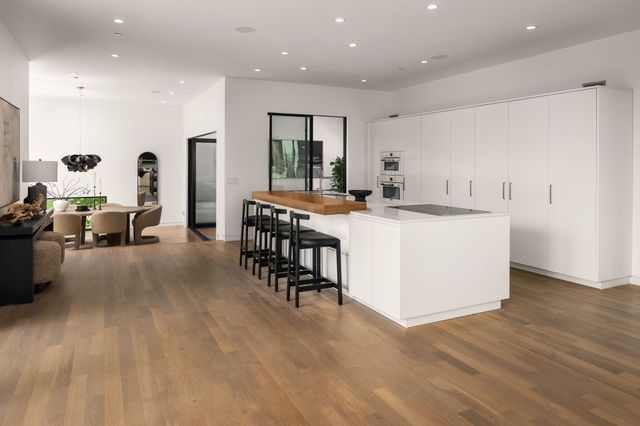 a view of living room with furniture and potted plants