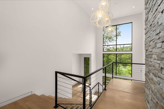 a living room with a flat screen tv and a fireplace