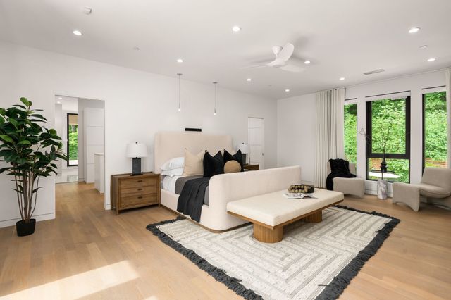 a kitchen with a large window and sink