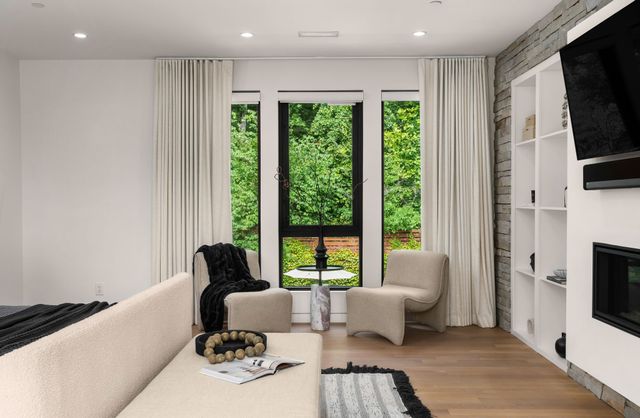 a bathroom with a bathtub and a glass door shower
