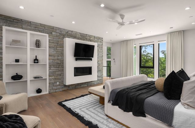 a view of a roof deck with couches and sky view