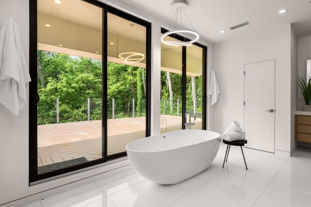 an empty room with wooden floor and a window