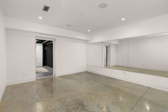 a front view of a house with a yard table and chairs