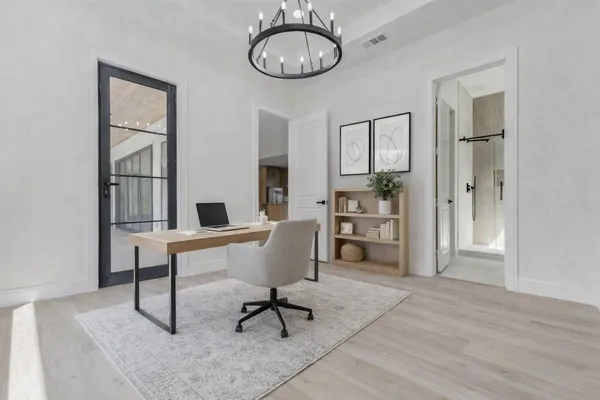 a living room with furniture a window and a chandelier