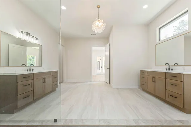 a view of a bathroom with bathtub and shower