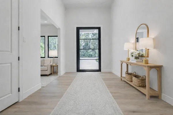 a view of a bedroom with furniture and a window