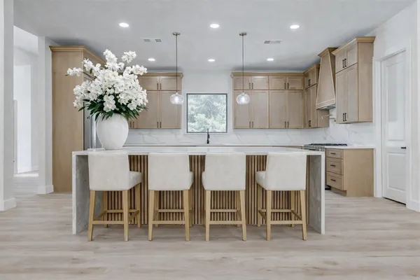 a kitchen with kitchen island granite countertop furniture table and chairs