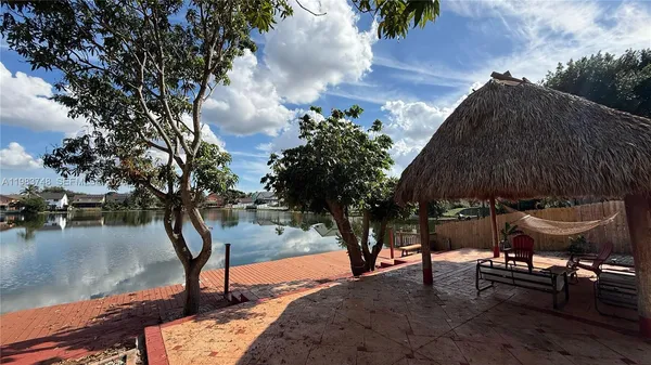 a view of a backyard with sitting area