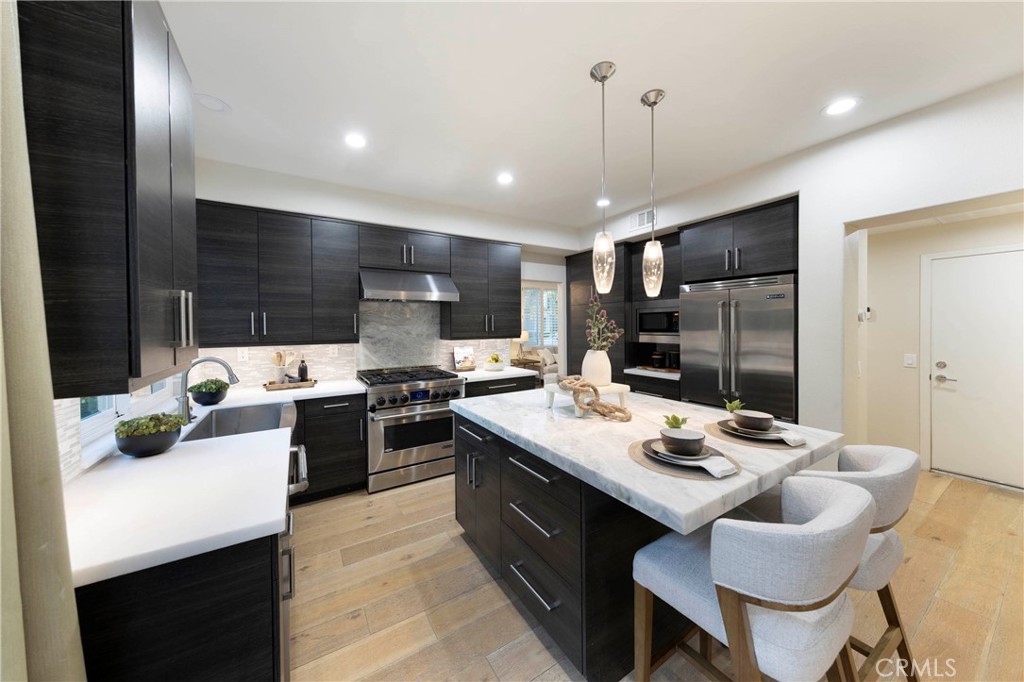 43 Lessay Newport Coast, CA 92657 - Photo 12 of 29 Remodeled kitchen boasting quality appliances and finishes.