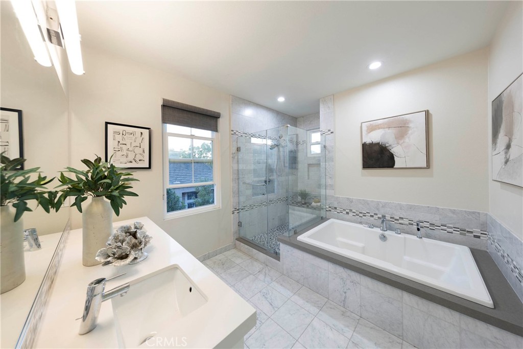 43 Lessay Newport Coast, CA 92657 - Photo 21 of 29 Primary remodeled ensuite bathroom with private toilet.
