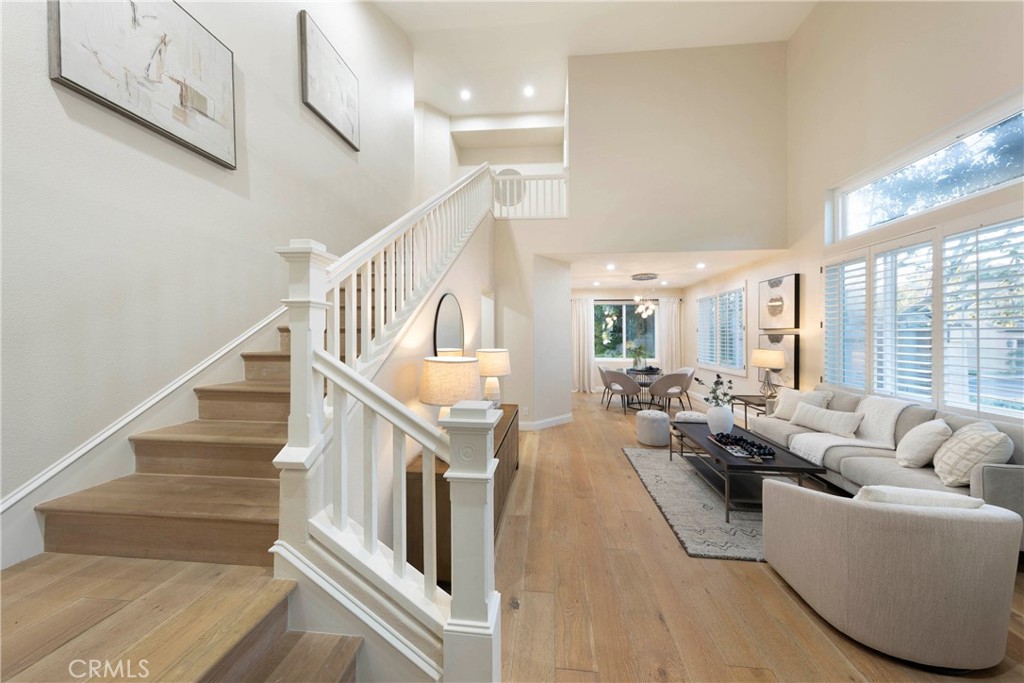 43 Lessay Newport Coast, CA 92657 - Photo 4 of 29 Entrance to home featuring expansive living room into dining, and quick access to second floor.