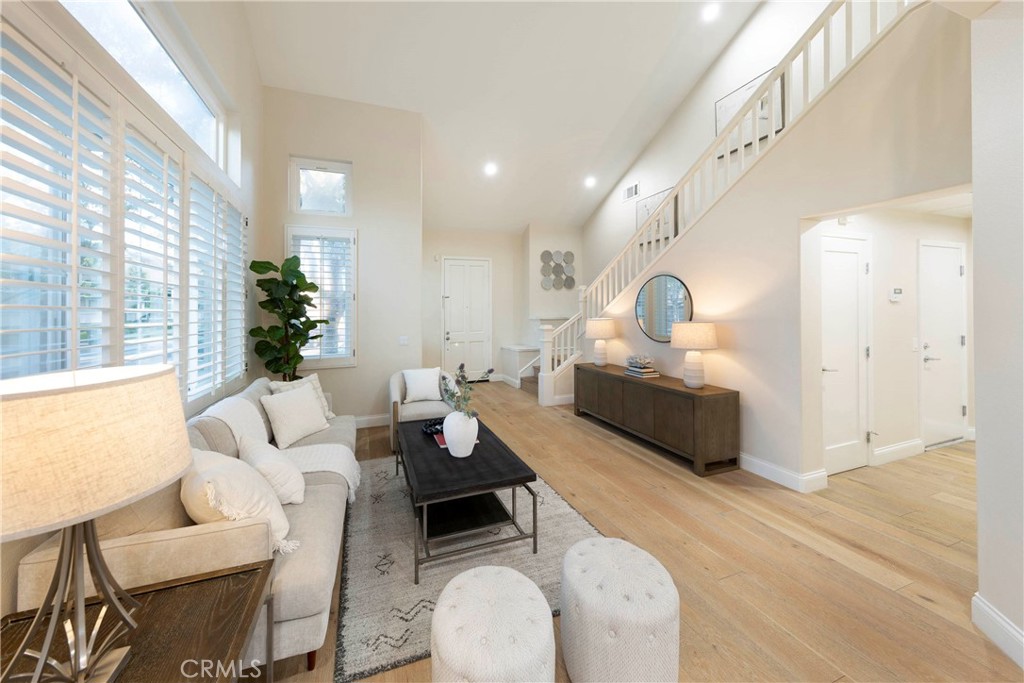 43 Lessay Newport Coast, CA 92657 - Photo 6 of 29 Living room flows directly into dining room with ample natural night throughout.