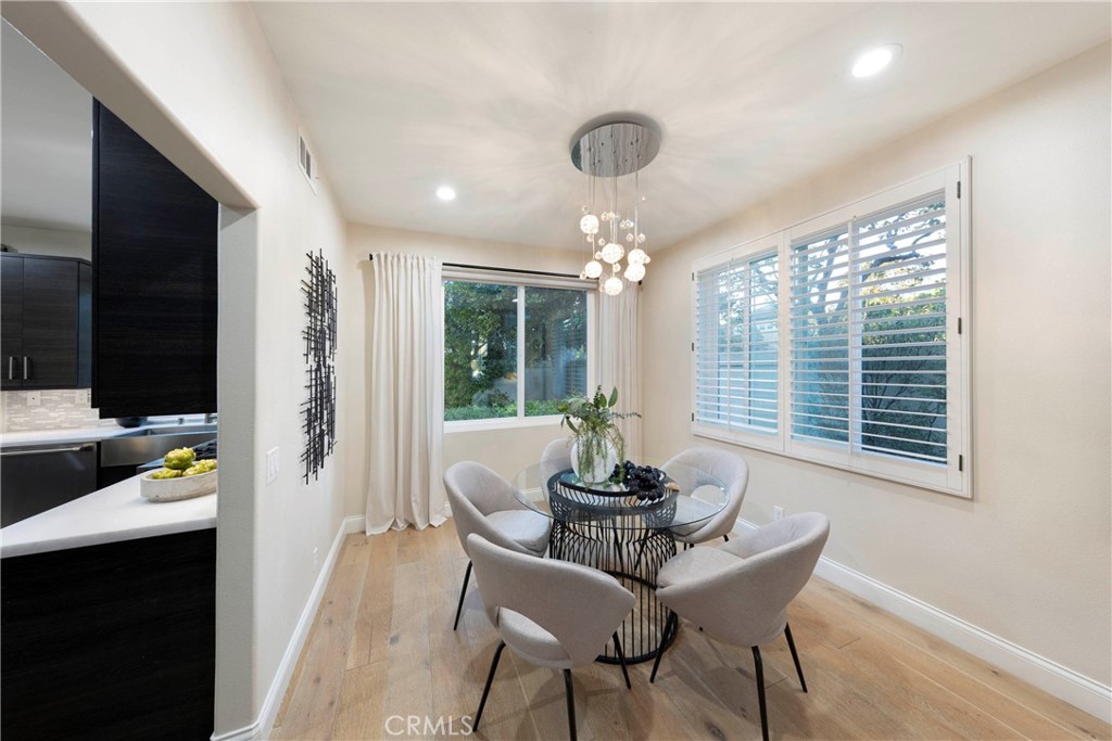 43 Lessay Newport Coast, CA 92657 - Photo 7 of 29 Dining room with view of back patio, open to living room and accessible to kitchen.