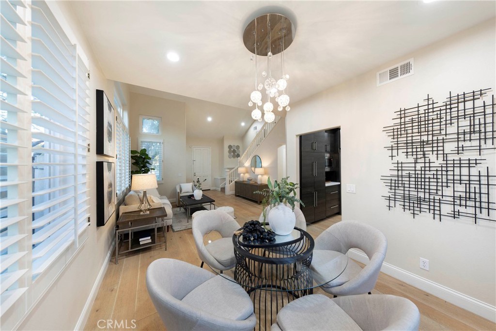43 Lessay Newport Coast, CA 92657 - Photo 8 of 29 Dining room with view of back patio, open to living room and accessible to kitchen.