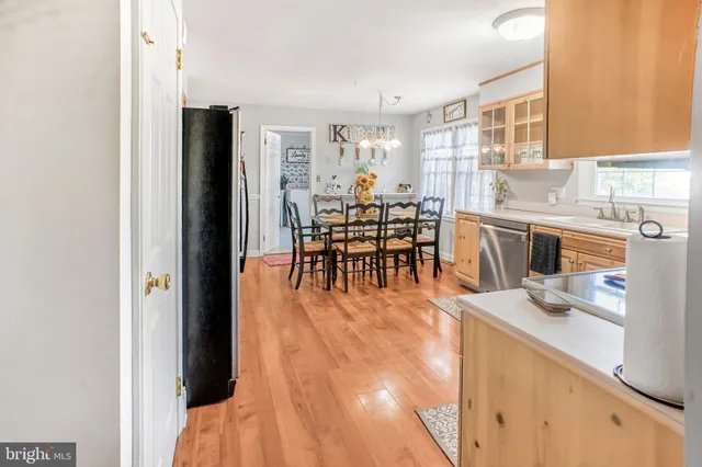 a dining room filled counter top space and a window