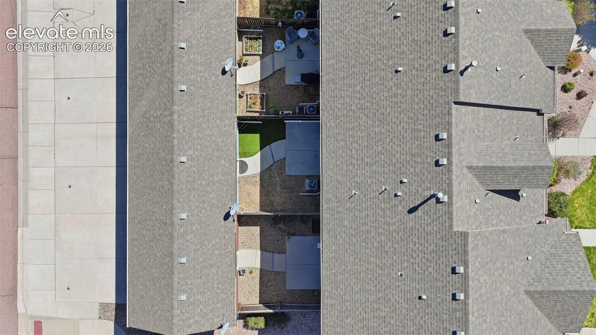 6306 Pilgrimage Road Colorado Springs, CO 80925 - Photo 36 of 37 aerial view of unit, yard, and detached garage