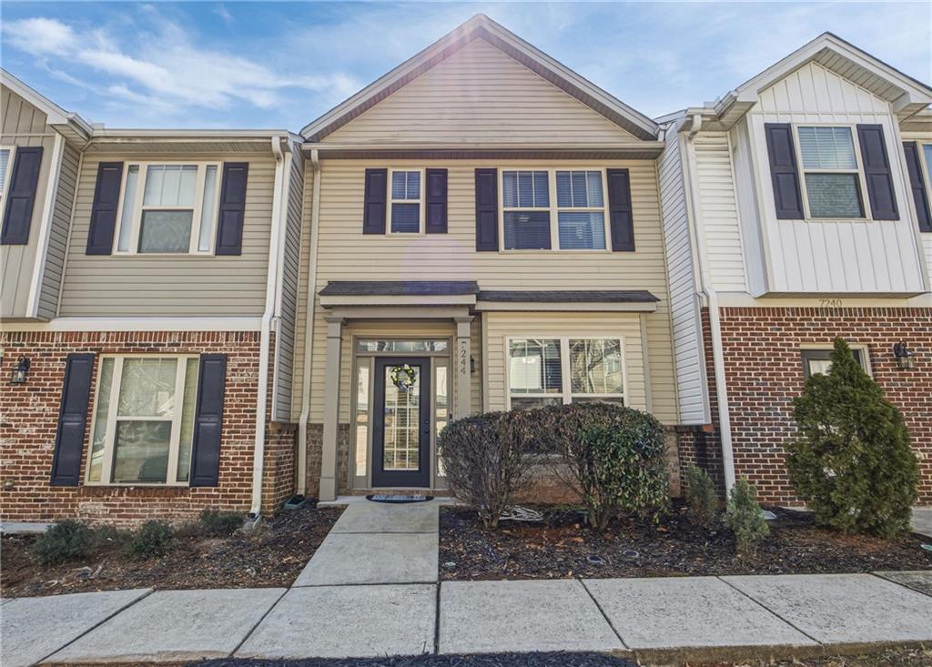 7244 Rockhouse Road, Unit 7 Austell, GA 30168 - Photo 1 of 26 a view of a brick house with many windows