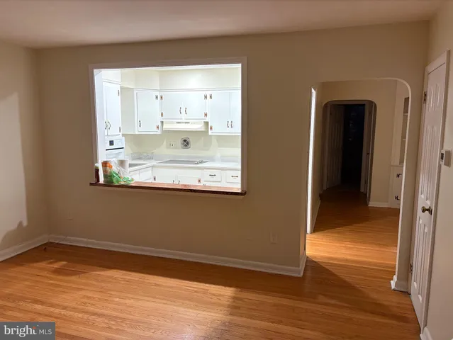 a view of a kitchen from an empty room
