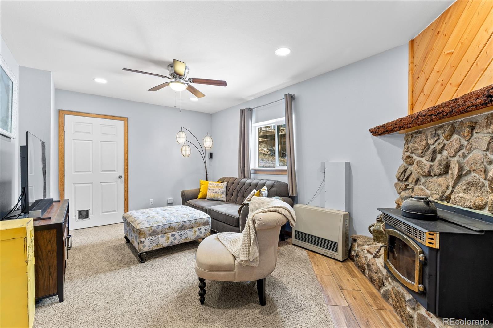 987 Wisp Creek Drive Bailey, CO 80421 - Photo 12 of 22 a bedroom with furniture and a window