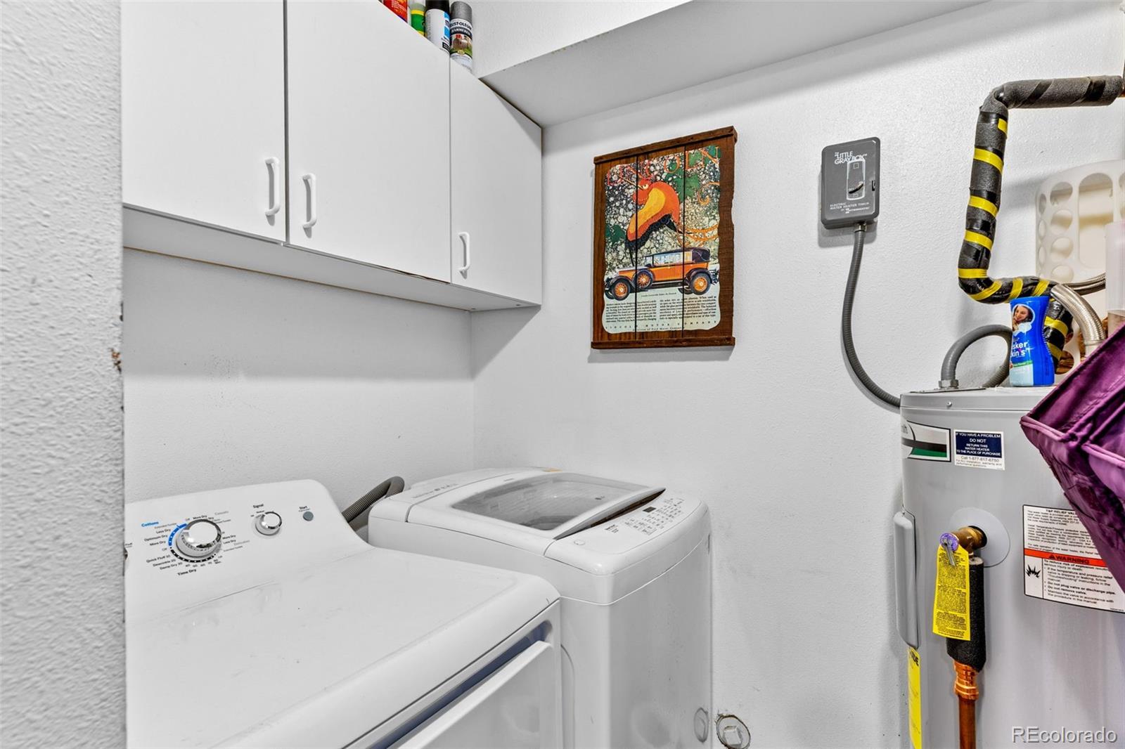 987 Wisp Creek Drive Bailey, CO 80421 - Photo 16 of 22 a utility room with dryer and washer