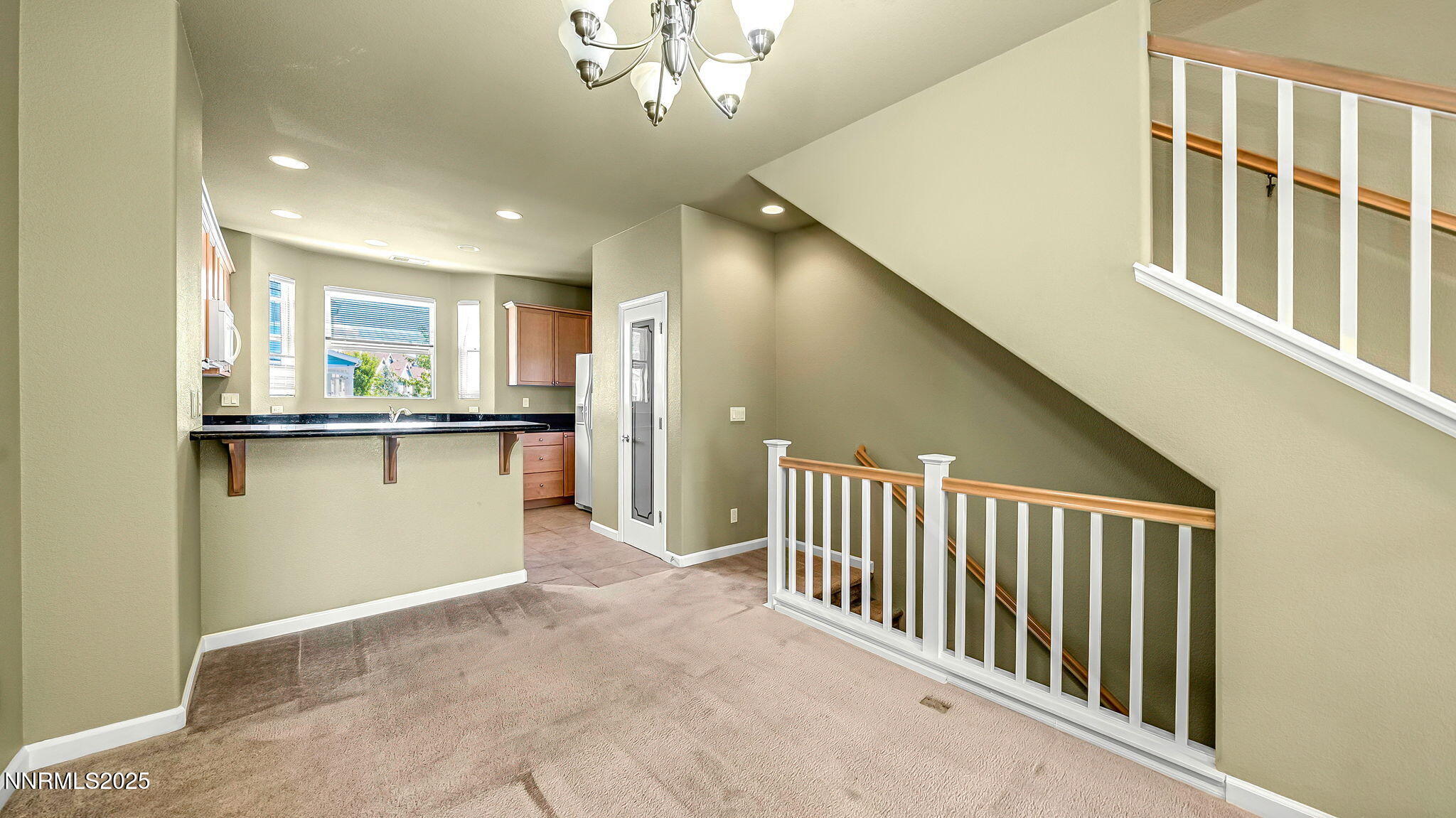 225 Gramercy Lane Reno, NV 89509 - Photo 12 of 40 a view of a hallway with a kitchen