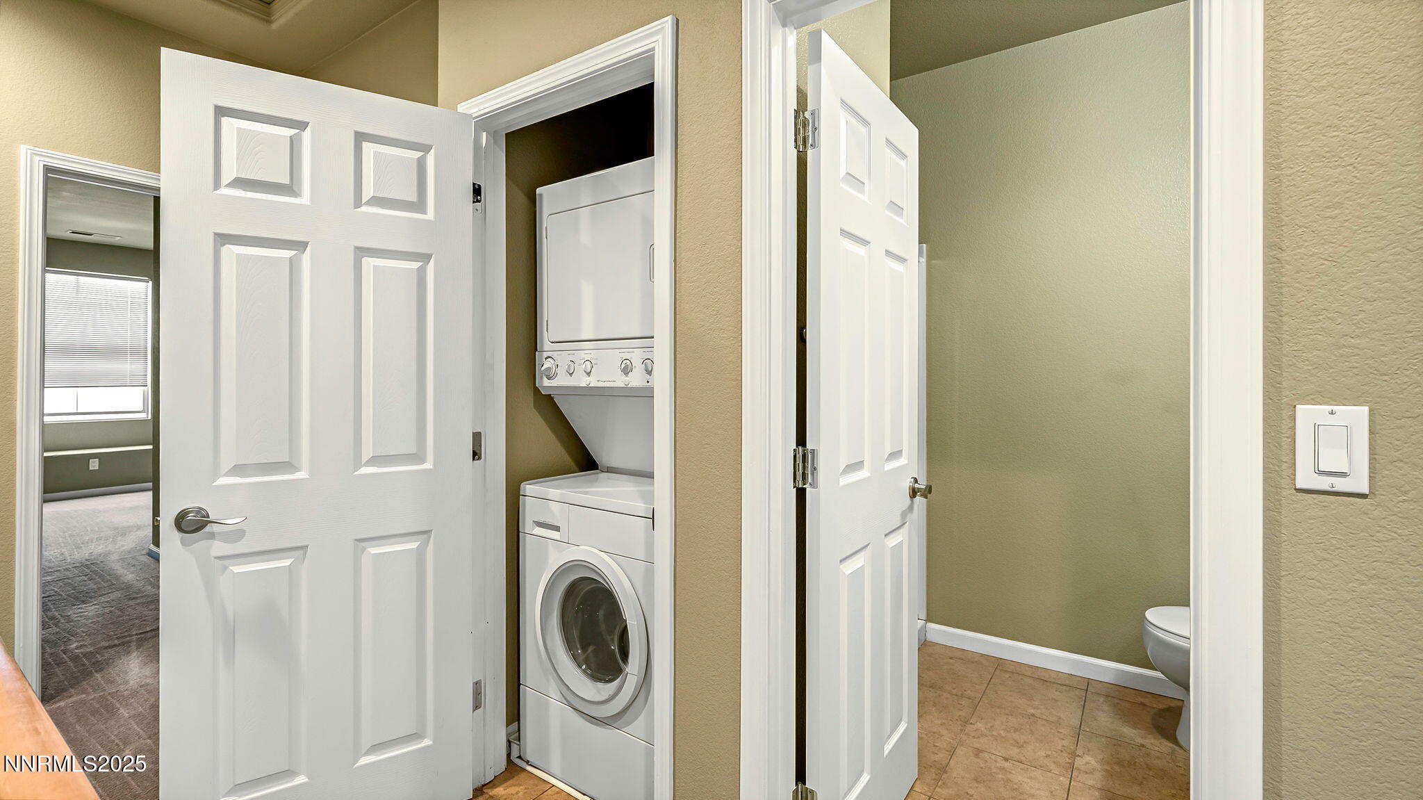 225 Gramercy Lane Reno, NV 89509 - Photo 26 of 40 a view of a hallway with washer and dryer