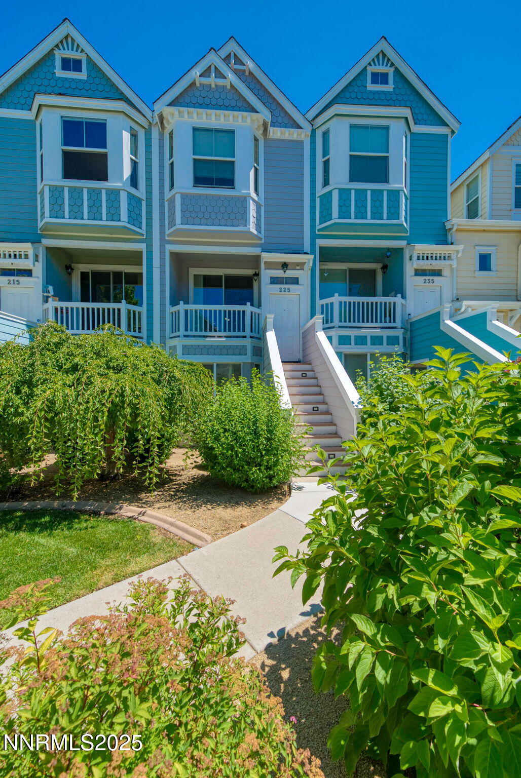 225 Gramercy Lane Reno, NV 89509 - Photo 3 of 40 a front view of a residential apartment building with a yard