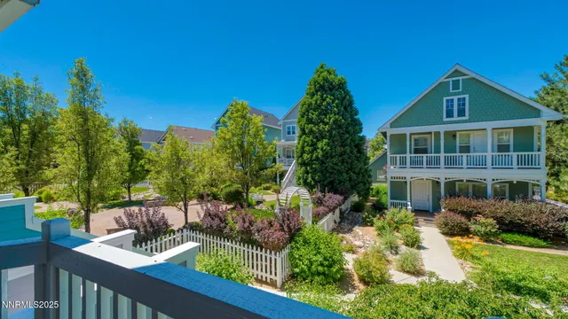 a view of a house with balcony and garden