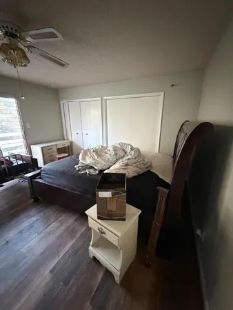 a bedroom with a bed and a balcony
