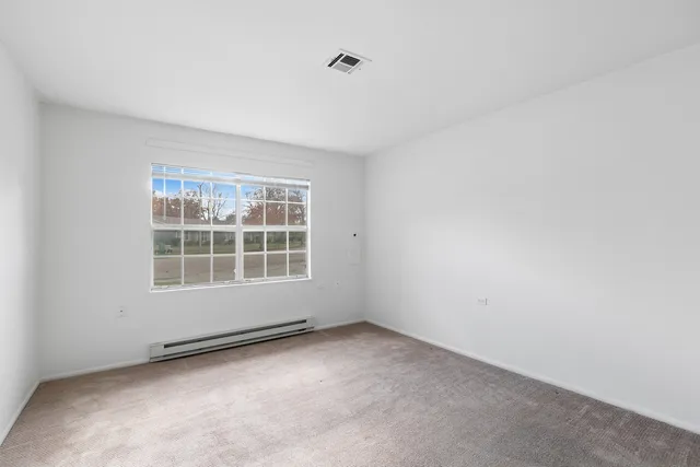 a bathroom with a sink a toilet and shower curtain