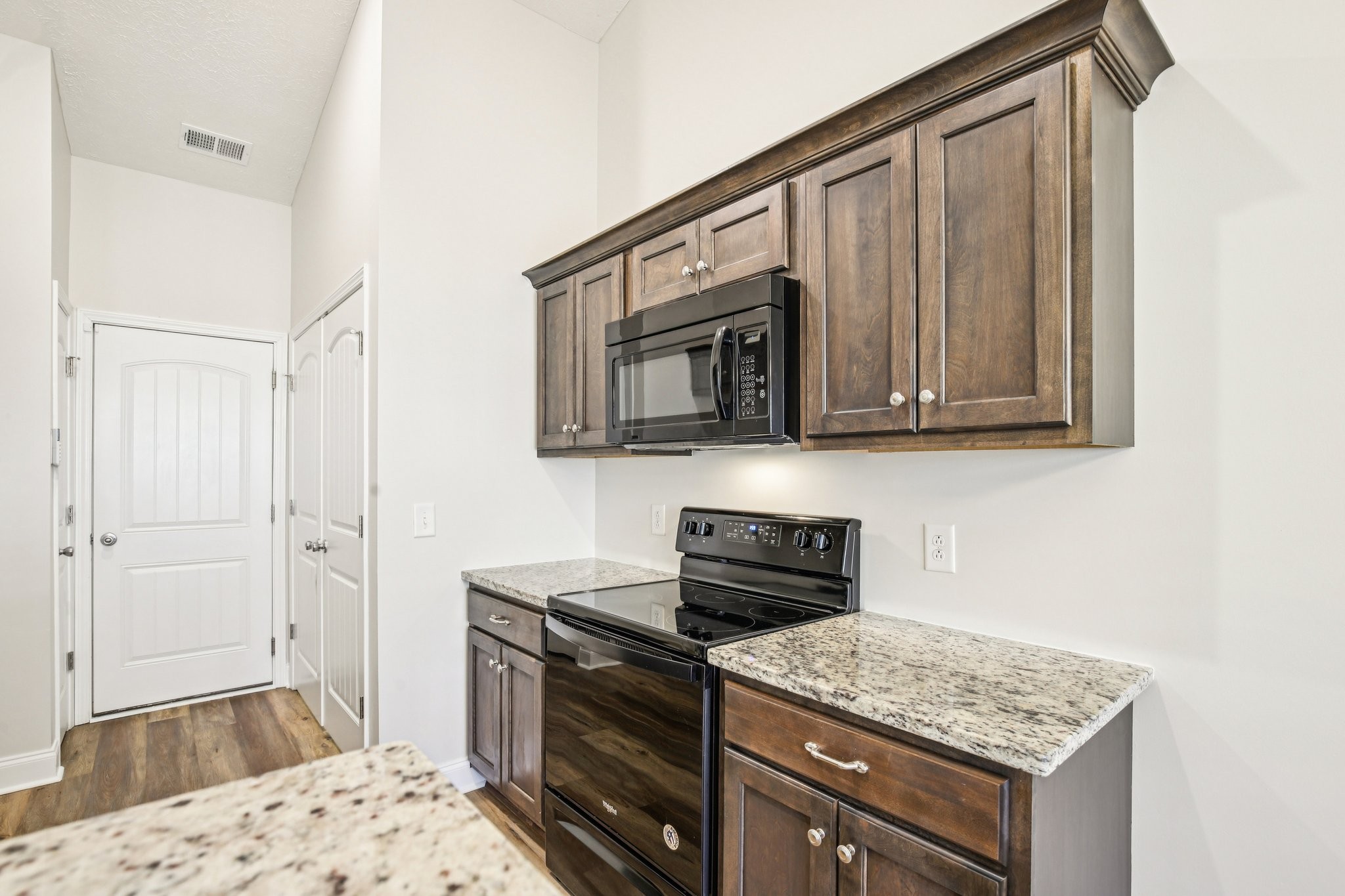 1030 Berra Drive Springfield, TN 37172 - Photo 5 of 13 a kitchen with stainless steel appliances granite countertop a sink stove and microwave