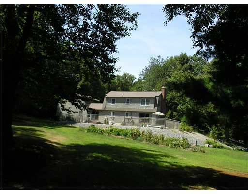 43 Balcom Road Foster, RI 02825 - Photo 10 of 13 Exterior Back. Beautifully landscaped 5.25 acres with 16 x32 in-ground pool, wrap around deck and vegetable garden.