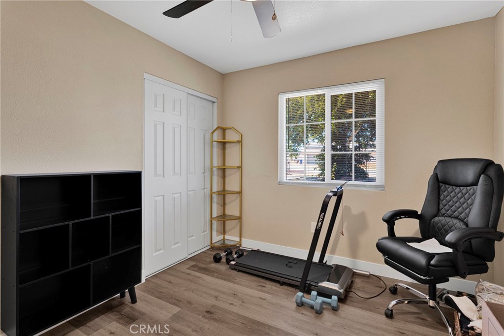 15471 Washoan Road Apple Valley, CA 92307 - Photo 22 of 38 a view of a livingroom with workspace and a window