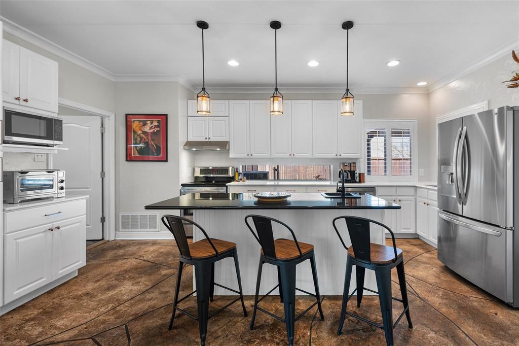 8903 Ravenswood Road Granbury, TX 76049 - Photo 12 of 36 Thoughtfully Designed Kitchen Island With Breakfast Bar & Second Sink