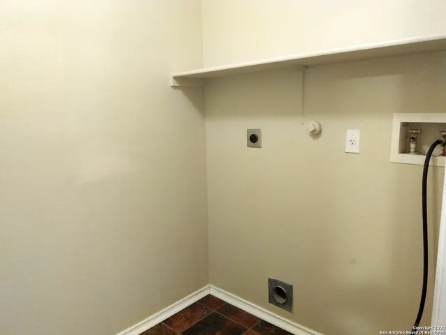 a bathroom with a shower and a toilet