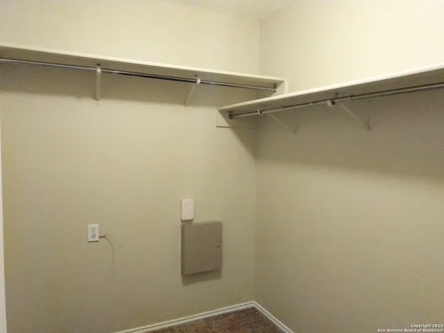 a view of a room with racks on the wall