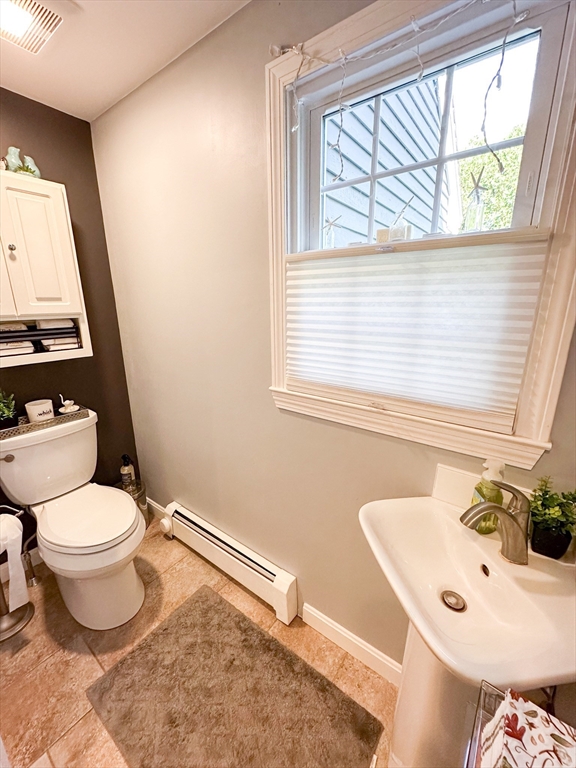 2 Applewood Circle Shrewsbury, MA 01545 - Photo 12 of 40 a bathroom with a sink a toilet and a window