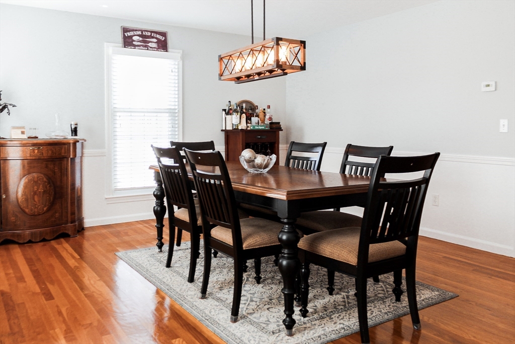 2 Applewood Circle Shrewsbury, MA 01545 - Photo 13 of 40 a view of a dining room with furniture a chandelier and wooden floor