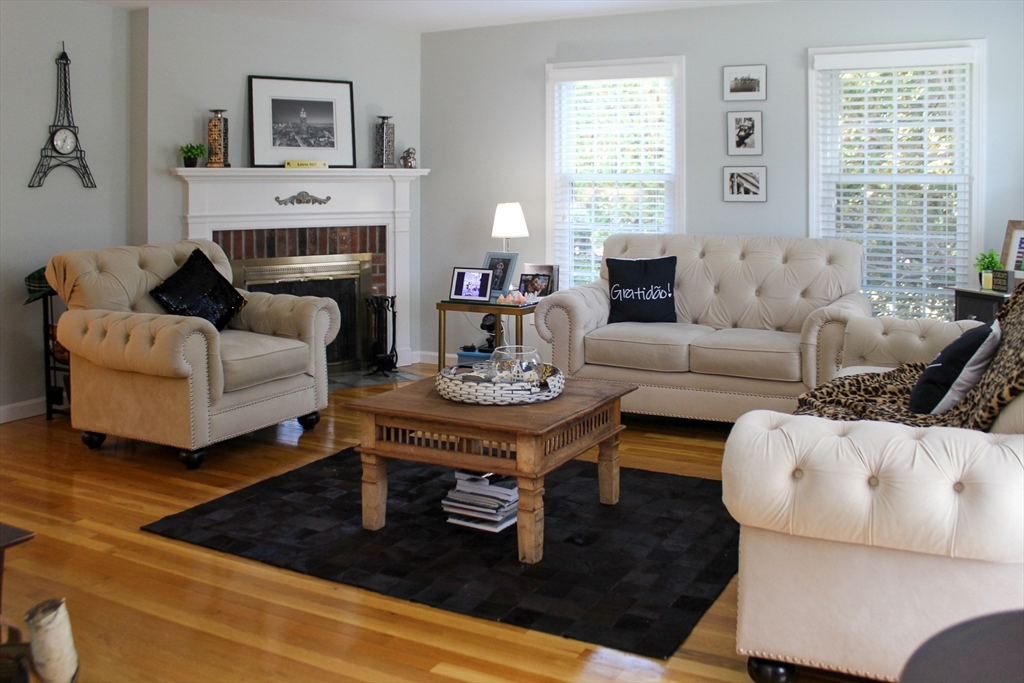 2 Applewood Circle Shrewsbury, MA 01545 - Photo 15 of 40 a living room with furniture and a fireplace