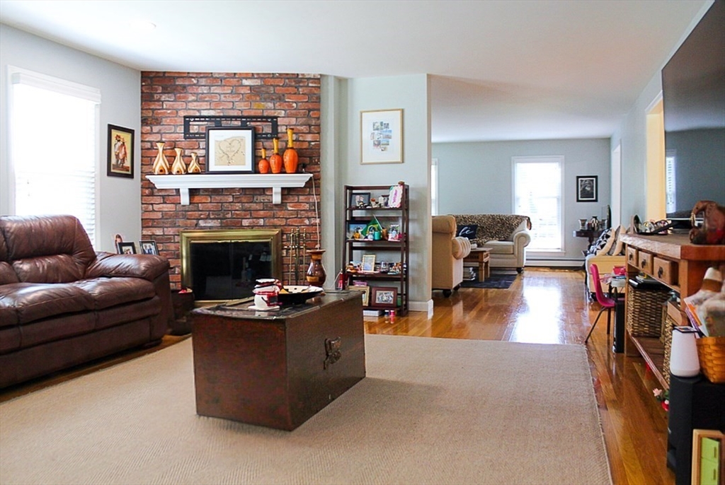 2 Applewood Circle Shrewsbury, MA 01545 - Photo 17 of 40 a living room with fireplace furniture and a fireplace