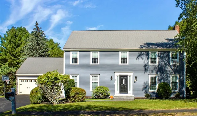 front view of a house with a garden