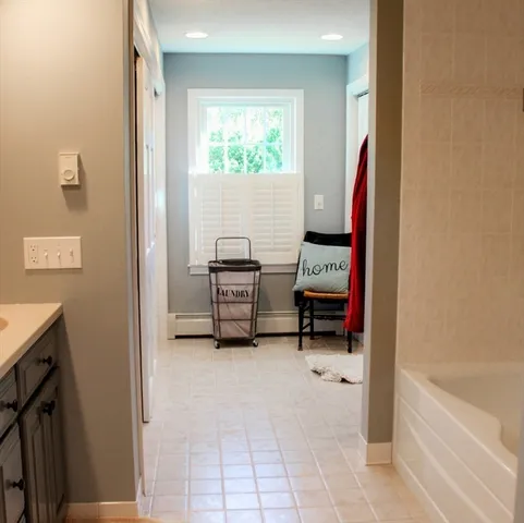 a bedroom with a bed and a tv