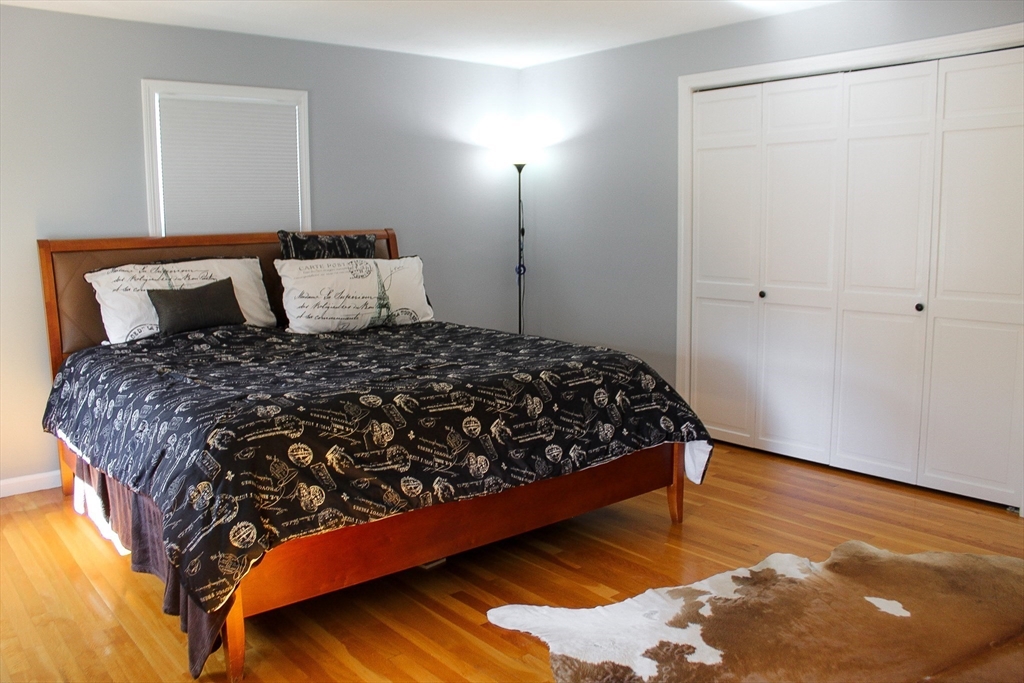 2 Applewood Circle Shrewsbury, MA 01545 - Photo 28 of 40 a large bed sitting in a bedroom next to a lamp